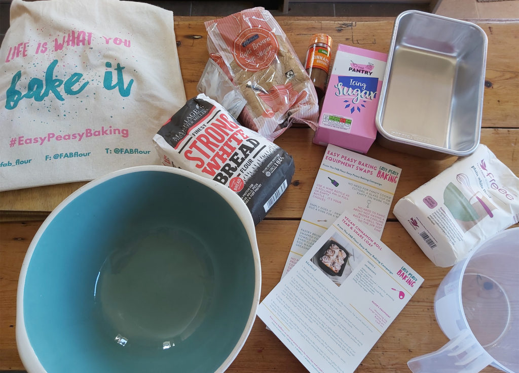 View from above of kitchen table with mixing bowl and packets of ingredients