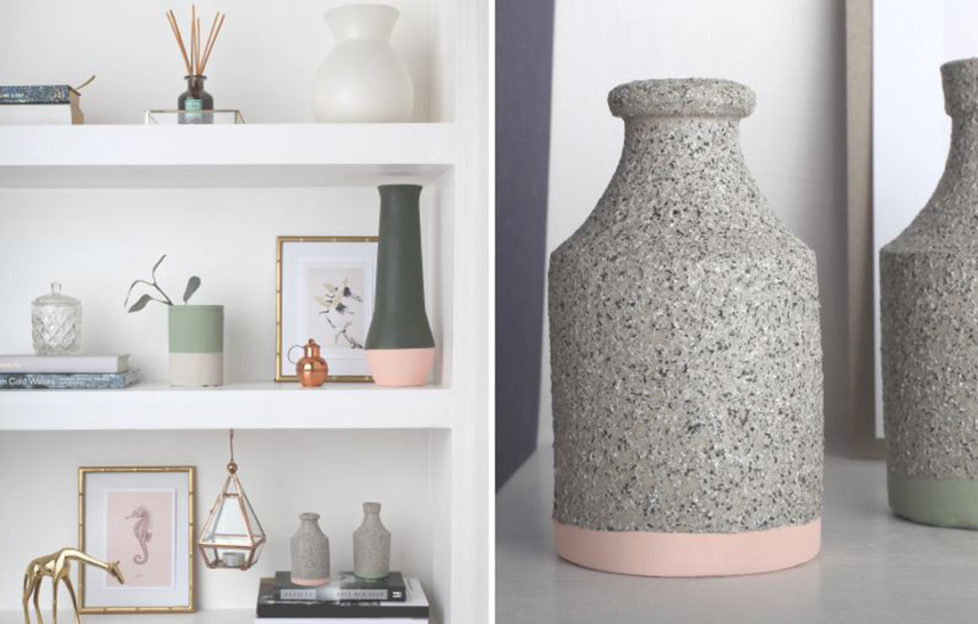 A selection of stone vases on a shelf