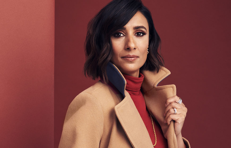 Anita Rani inmodels camel coat and red roll neck top