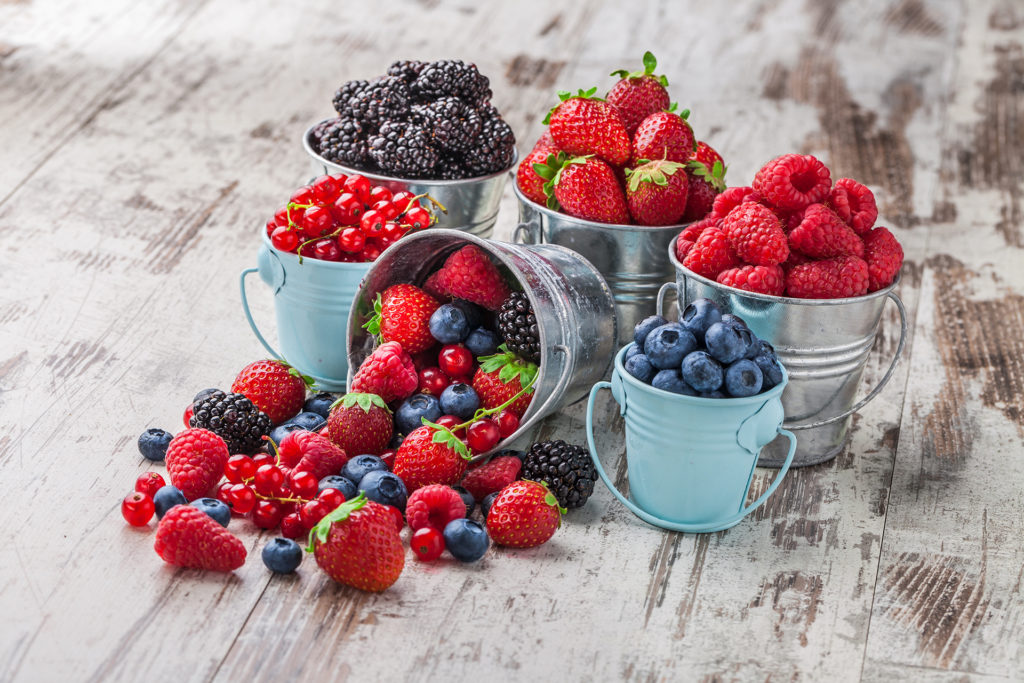 Little metal buckets of berries - strawberries, blackberries, cranberries etc