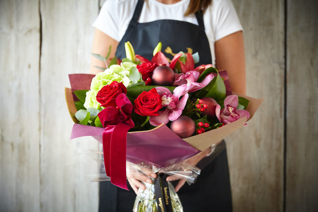 Woman holding bouquet of flowers