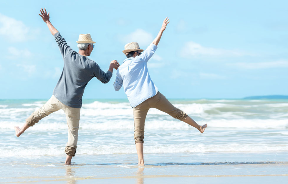 Asian Lifestyle senior couple jumping on the beach happy in love romantic and relax time. Tourism elderly family travel leisure and activity after retirement in vacations and summer.
