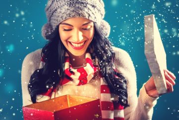 Lady opening Christmas gift Pic: Shutterstock