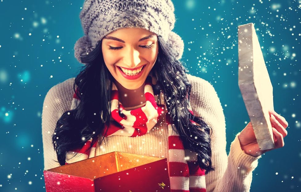 Lady opening Christmas gift Pic: Shutterstock