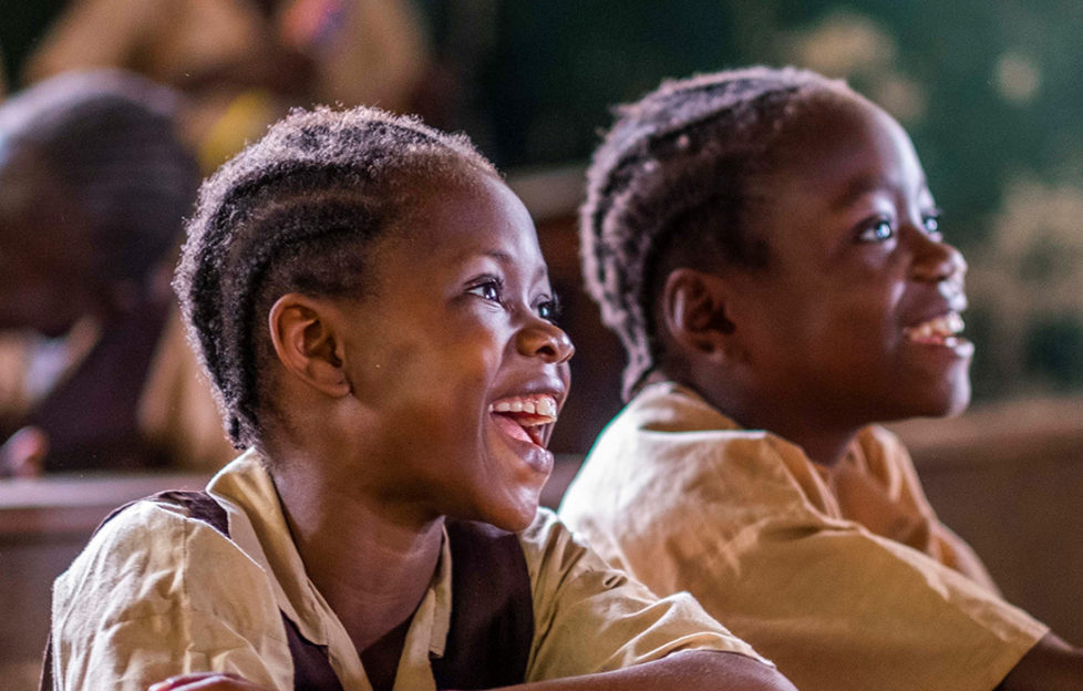 Smiling children in a class in Liberia Pic: Chris Watt