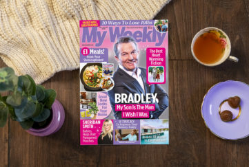 Lifestyle image on dark wooden floor including cover of My Weekly latest issue Jan 5 with Bradley Walsh and storecupboard £1 meals