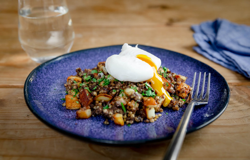 Haggis, potatoes and poached egg breakfast or brunch dish