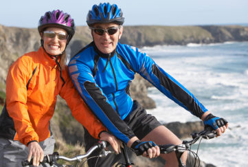 Couple cycling on coastline Pic: Shutterstock