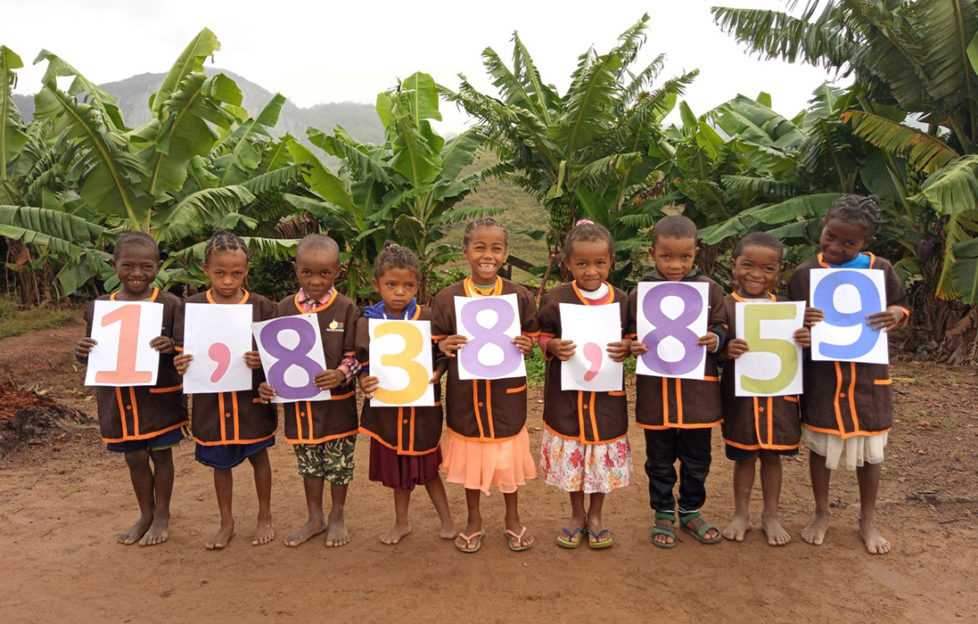 Children from Ankarinomby Primary School in Madagascar celebrate Mary’s Meals feeding 1.8 million children