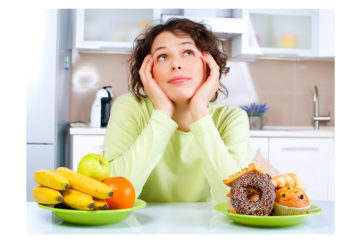 Lady looking at two bowls of food Pic: Shutterstock