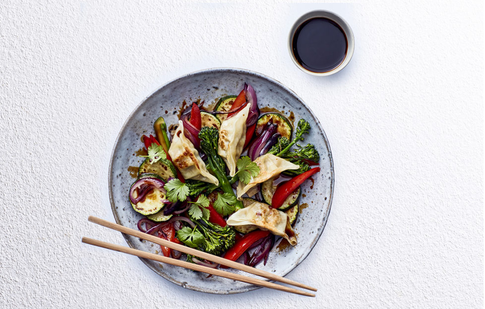 gyoza stir fry with chopsticks