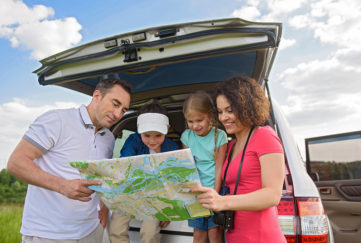 Happy family enjoying road trip and summer vacation; Shutterstock ID 471296090