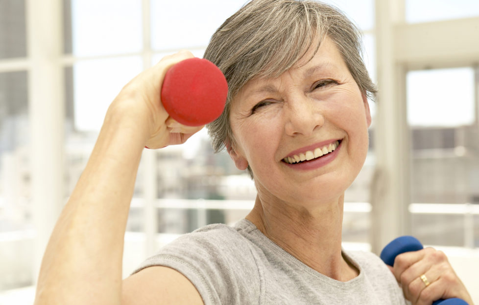 Senior exercising at gym;