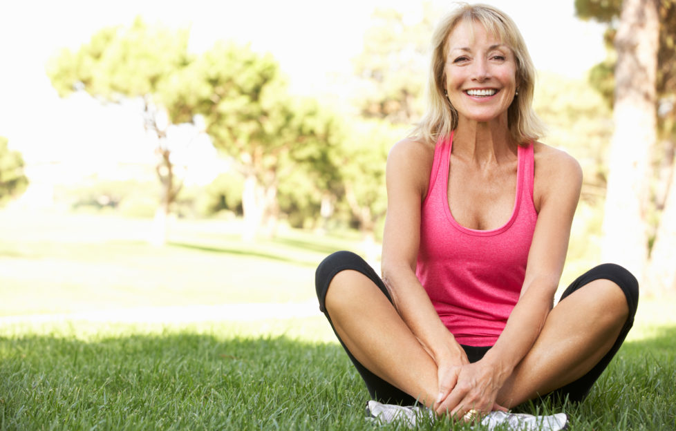 Senior Woman Resting After Exercising In Park;