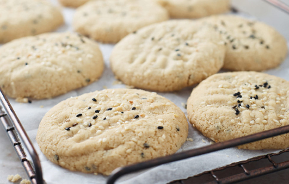 pale golden tahini cookies on cooking rack