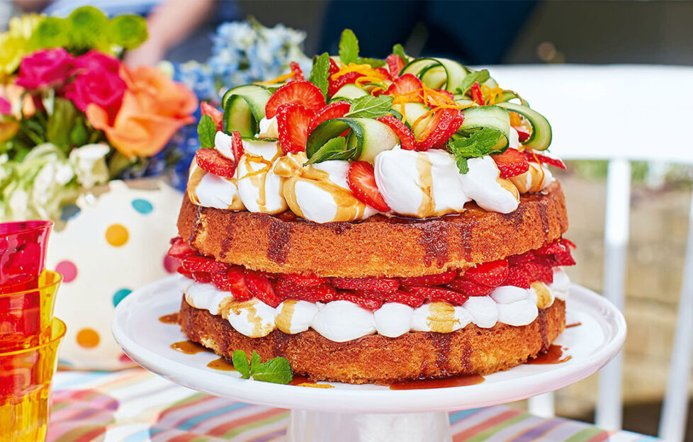 Layered sponge cake with strawberries, cream and cucumber ribbons