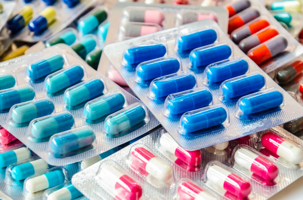 pharmaceuticals antibiotics pills medicine /colorful antibacterials pills on  white background /capsule pill medicine ; 