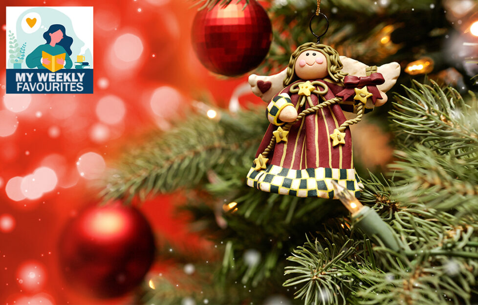 Angel or fairy made of clay with fabric dress, hanging on Christmas tree