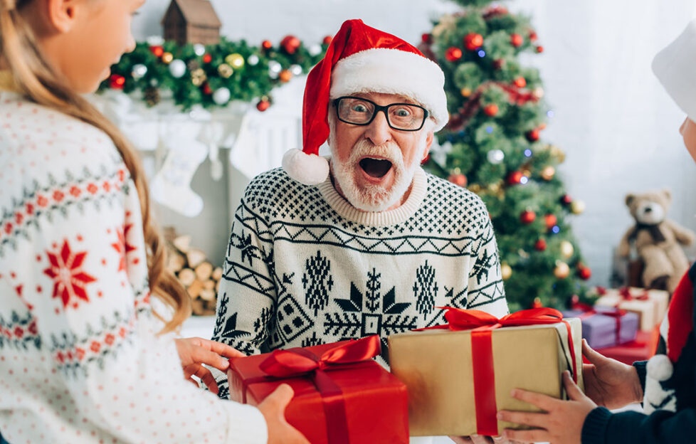 Older man accepting Christmas gifts Pic: Shutterstock