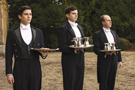 FOR IMMEDIATE USE DOWNTON ABBEY Series Six Coming soon to ITV Pictured JROBERT JAMES-COLLIER as Thomas Barrow, MICHAEL FOX as Andy Parker and KEVIN DOYLE as Joseph Molesley Later in the year we return to the sumptuous setting of Downton Abbey for the sixth and final season of this internationally acclaimed hit drama series. As our time with the Crawleys begins to draw to a close, we see what will finally become of them all. The family and the servants, who work for them, remain inseparably interlinked as they face new challenges and begin forging different paths in a rapidly changing world. Photographer: Nick Briggs © Carnival Films