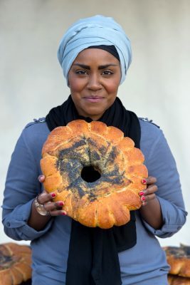 LONDON, ENGLAND - MAY 17: Nadiya Hussain poses with a Great Fire of London inspired bake during a photocall opening a new experience at The London Dungeon, which marks the 350th anniversary of the Great Fire of London, on May 17, 2016 in London, England. (Photo by Ben A. Pruchnie/Getty Images)