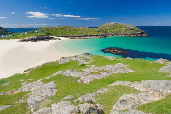 Beach at Achmelvich in the Scottish Highlands on a beautiful summers day. One of the best beaches in Scotland.