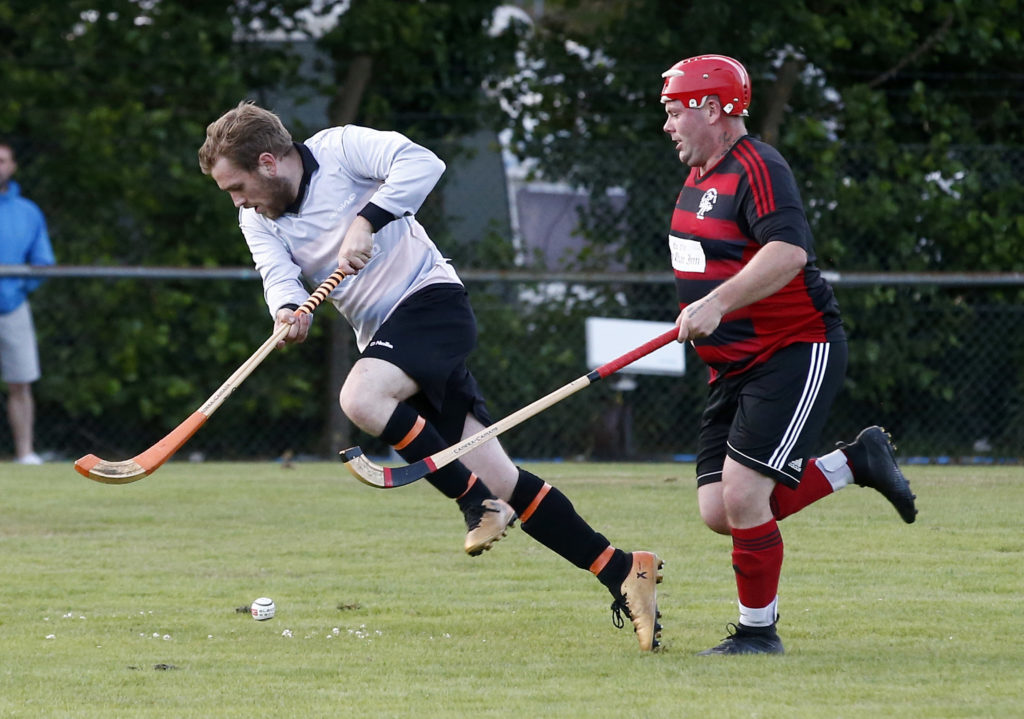 Lochside Rovers’ Ewan McCorquodale chases down Taynuilt’s Gerry Kilmurray  during Friday night’s South Division One game at Mossfield. Photo: Stephen Lawson