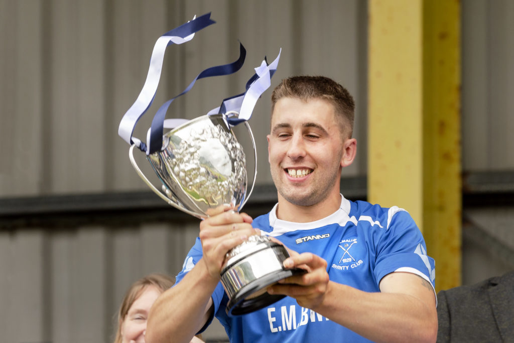 Kilmallie captain Liam Macdonald is delighted to get his hands on the trophy.  Liberty British Aluminium Balliemore Cup Final - Kilmallie v Glasgow Mid Argyll - played at An Aird, Fort William.