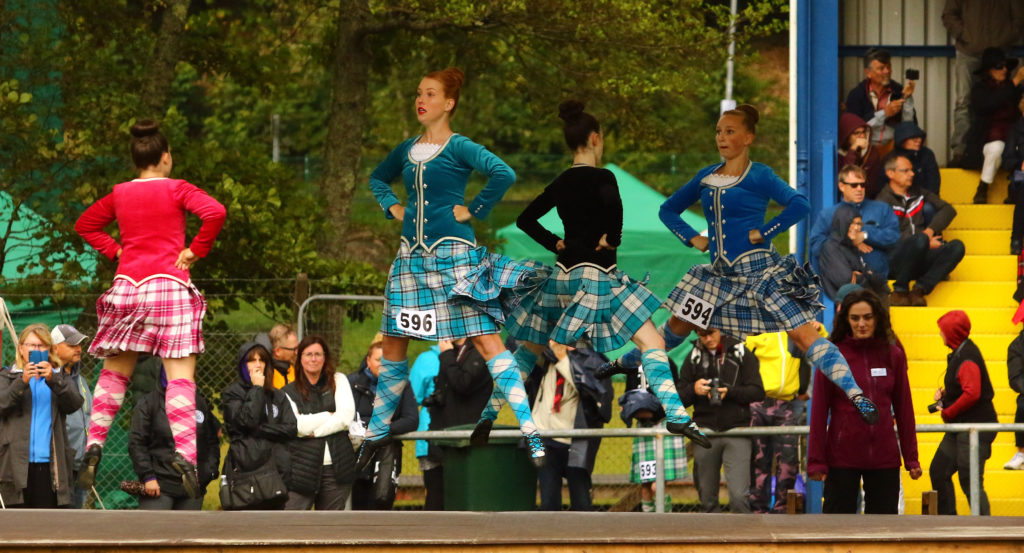 Highland dancers performed under cover from the rain.