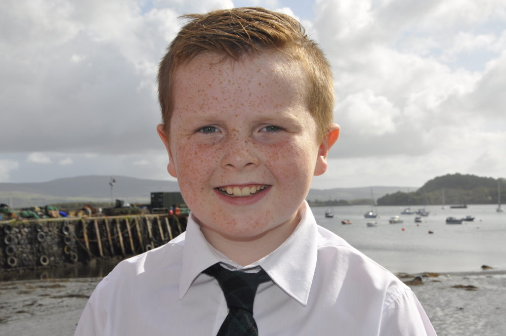 Innes MacKay, 10, gets a hat-trick of Mòd wins for his own choice song.