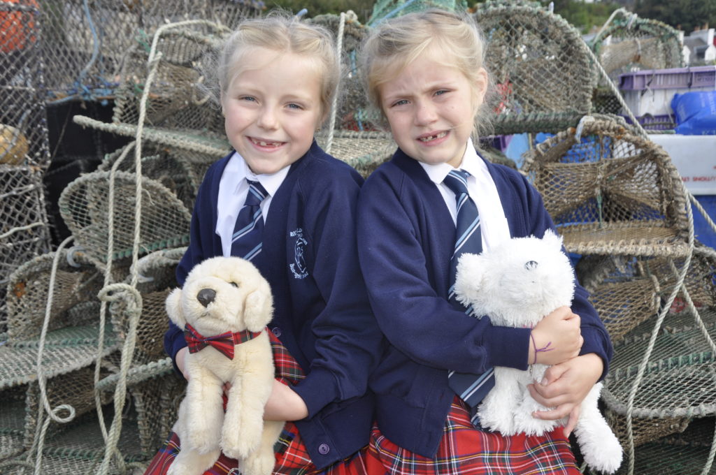 Eva, eight, and Bethany, six, Bisp from Oban's Rockfield Primary School took their mascot dogs to the Mòd for luck.