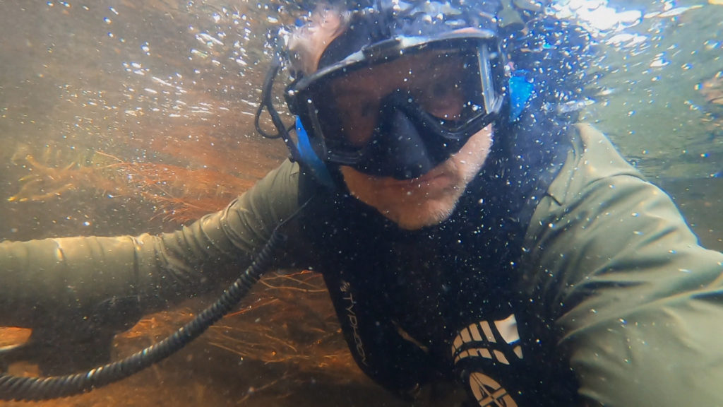 Beau Ouimette under water searching the River Lochy.