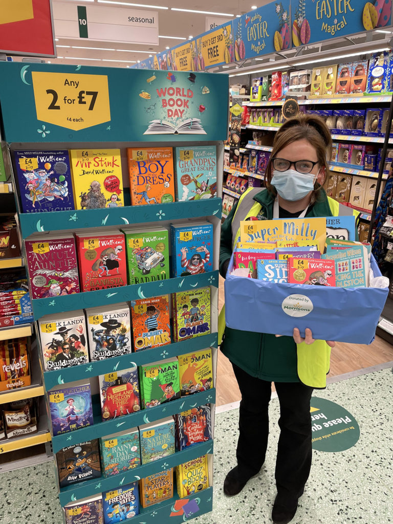 Emma Macinnes, Community Champion at Morrisons Fort William, with a selection of books for children. NO F10 Morrisons world book day