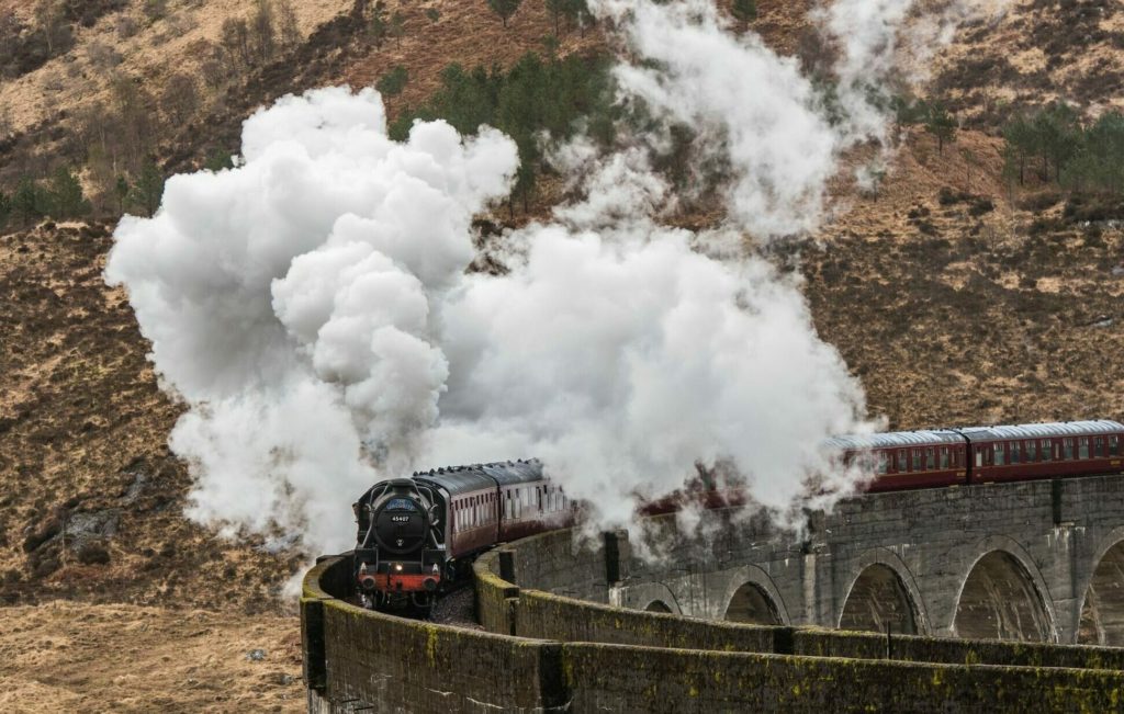 The Jacobite steam train draws tens of thousands of visitors each year to Glenfinnan to see it cross the famous viaduct. Photograph: Iain Ferguson, The Write Image. NO F26 jacobite steam train 01