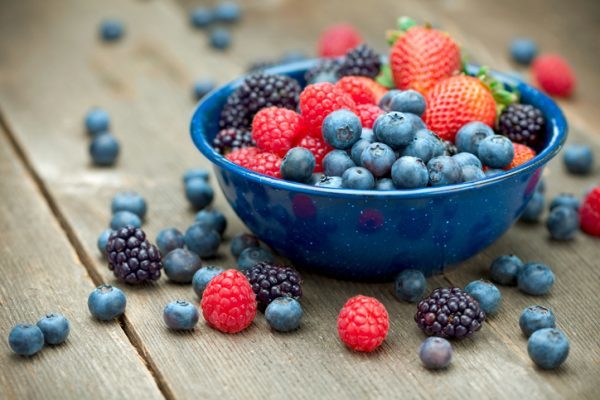 "A bowlful of delicious organic berries. Strawberries, blackberries, blueberries and raspberries. Shallow dof" Fruit and veg