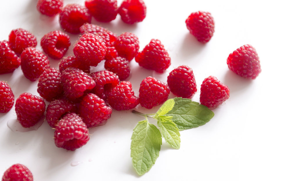 Fresh raspberries, white background. Prune