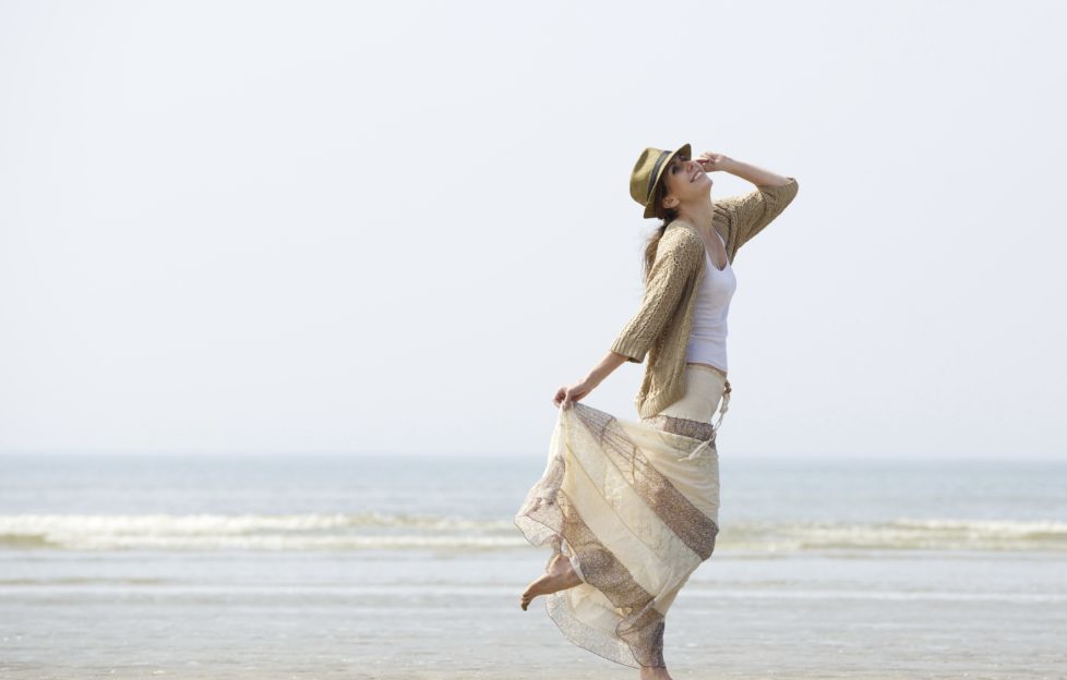 Portrait of a middle aged woman enjoying a day at the beach. Avoiding falls.