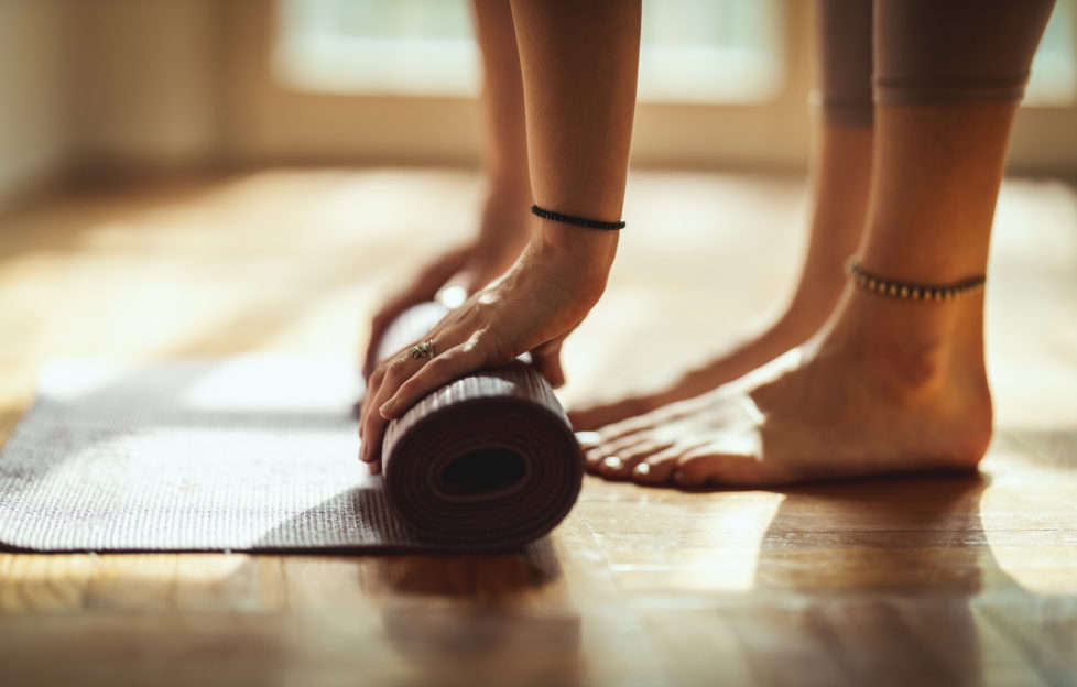 woman with yoga mat