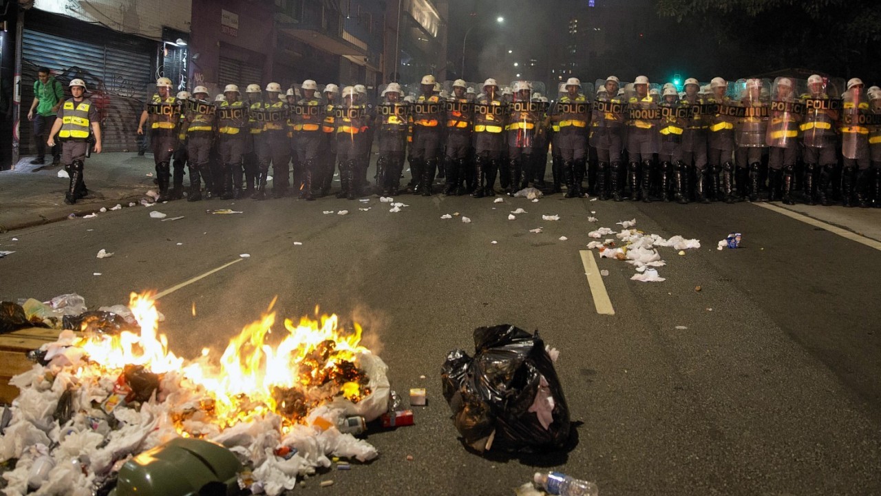 Riot police take position during a protest against money spent on the World Cup preparations in Sao Paulo, Brazil