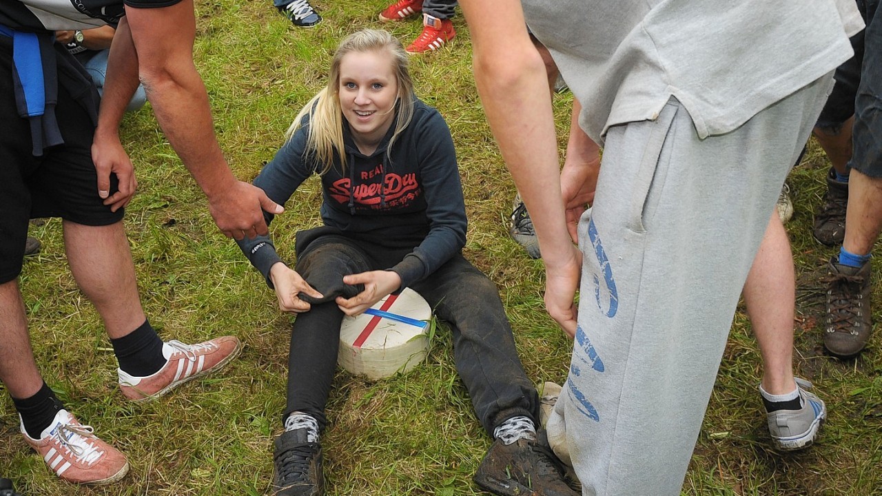 17 Year-old hairdressing student Lucy Townsend, from Brockworth, wins the Women's Downhill race for the third year running in the Cheese Rolling on Cooper's Hill race near Brockworth, Gloucestershire