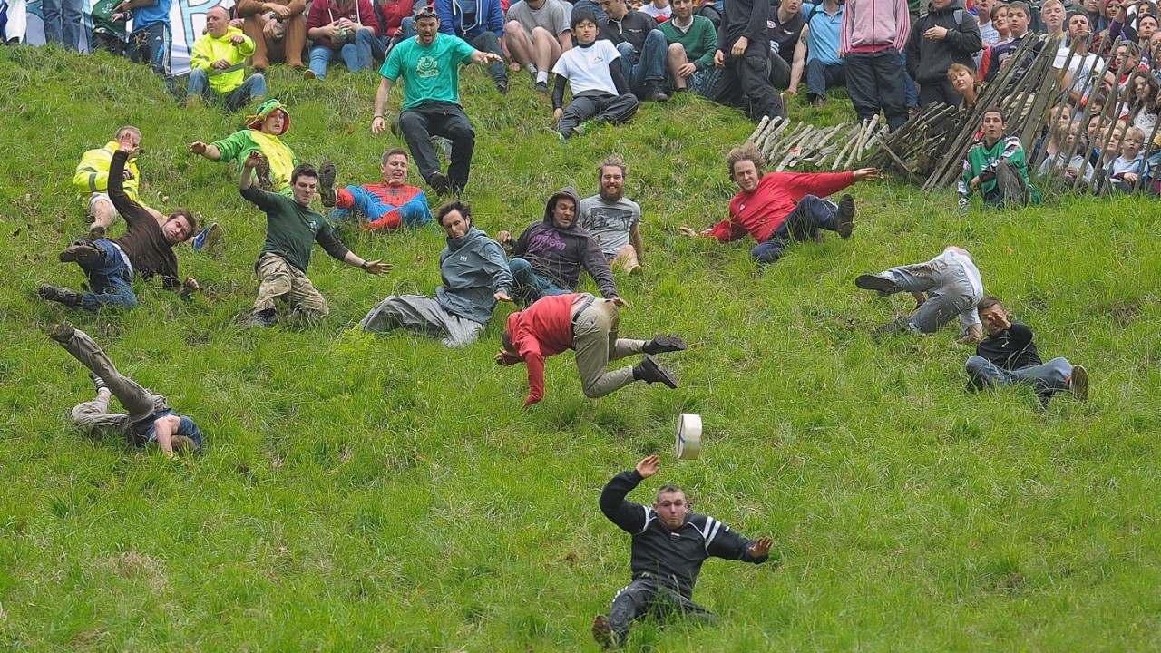 Competitors in the Cheese Rolling on Cooper's Hill race near Brockworth, Gloucestershire