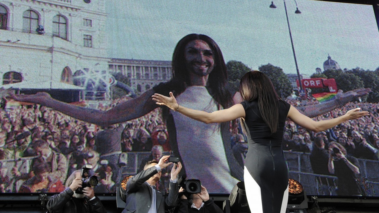 Austrian singer and Eurovision Song Contest winner Conchita Wurst performs on stage in front of the federal chancellery in Vienna, Austria