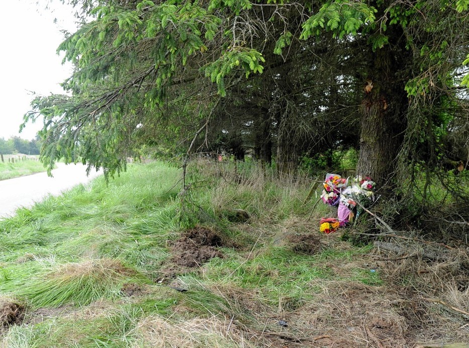 Floral tributes left at the scene near Culbokie