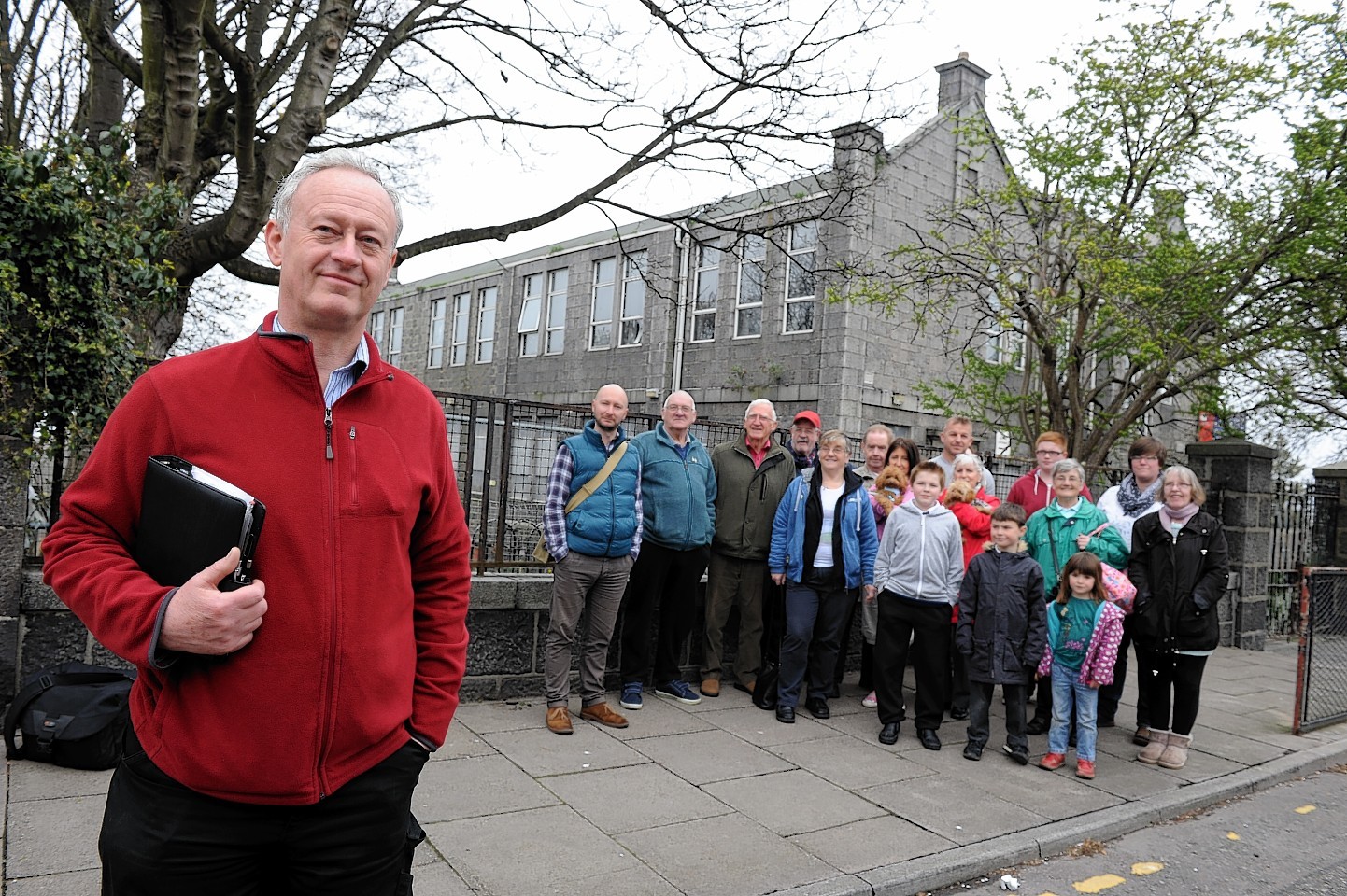 David Fryer outside Victoria School