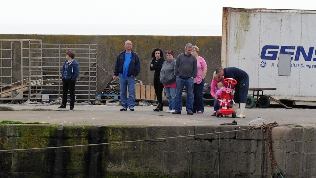 Families and locals have been waiting at the harbour for information