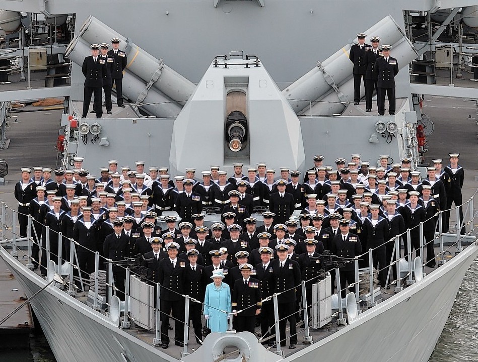 Ministry of Defence handout photo of Queen Elizabeth II with the crew of HMS Lancaster during a visit to the ship