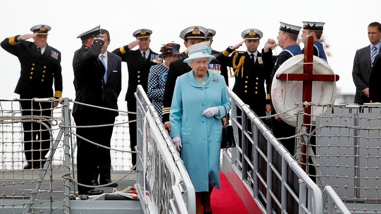 Queen Elizabeth II receives a Royal Salute during a visit to HMS Lancaster at Portsmouth Naval Base, Hampshire