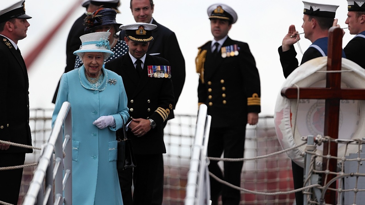 Queen Elizabeth II receives a Royal Salute during a visit to HMS Lancaster at Portsmouth Naval Base, Hampshire