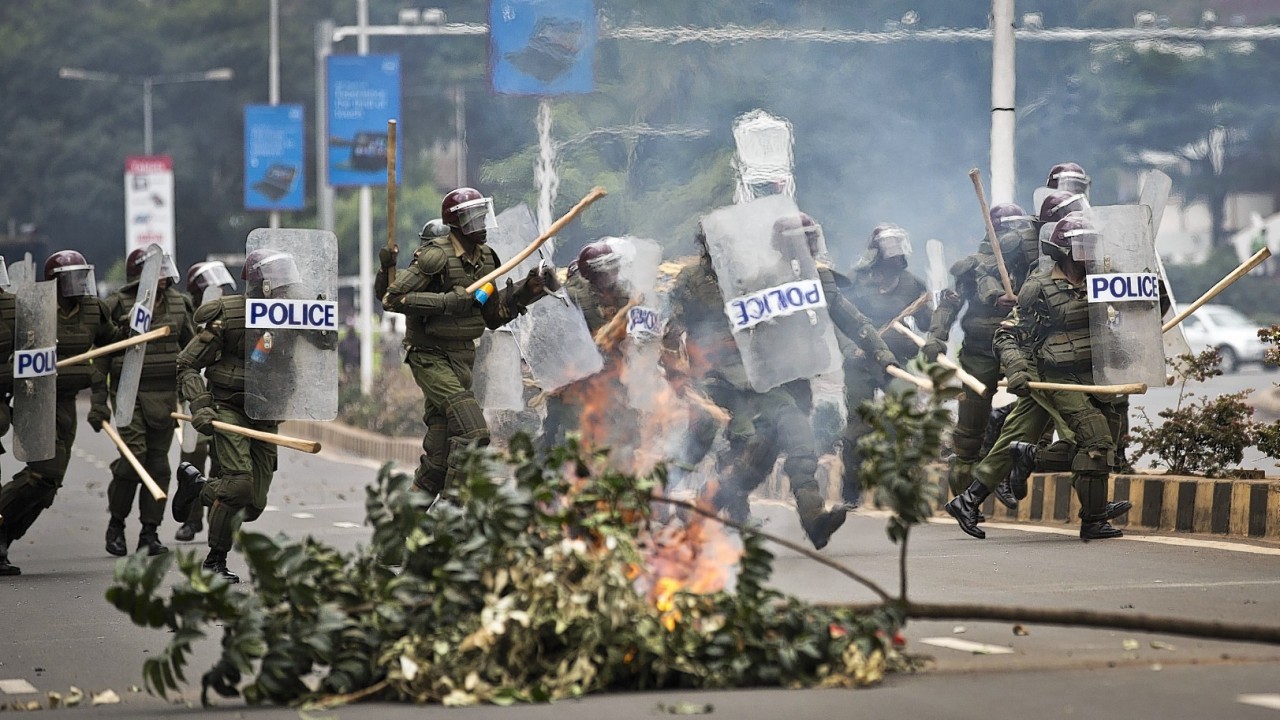 Kenyan university students on Tuesday carried out demonstrations over a proposed increase in student fees, but the protests quickly turned into hours of running battles between students throwing rocks and security forces firing tear gas, before riot police chased the students inside their campus and cornered them in a building into which they fired dozens of tear gas grenades and for a while prevented anyone from leaving