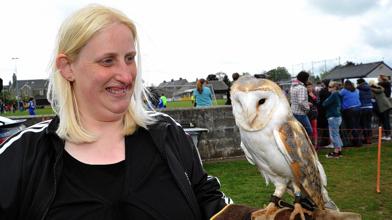 Gail Geddes with Rocket, a barn owl